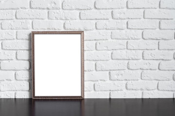 Wall Mural - Blank picture frame against brick wall with copy space