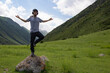 © Chepko Danil - Young man preforms yoga in mountains in morning light