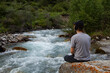 © Chepko Danil - Young man preforms yoga in mountains river