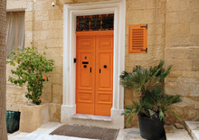 Traditional Vintage Painted Wooden Door In Malta. Popular Travel Destination. Entrance To House. Exterior Of Typical Houses On The Mediterranean Island Of Malta - April, 2022.
