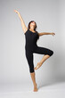 © Alexander Y - Young modern ballet woman dancer dancing on gray studio background