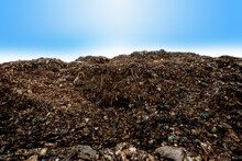 A Huge Pile Of Plastic Waste In The Sun And The Blue Sky.
