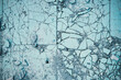 Blue abstract backdrop. Broken ceramic tiles on the ground texture background. Crashed, shattered and cracked dirty blue stone tiles surface. Multiple mosaic pieces. Cold navy, space for design