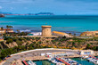 El Campello tower landmark tourist attraction with marina boats and Benidorm in background Alicante Spain