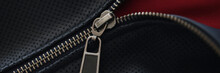 Closeup Of Zipper On Blue Leather Jacket