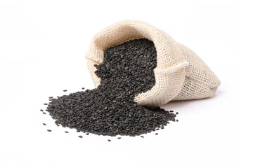 Wall Mural - Black sesame seeds in sack bag isolated on white background.