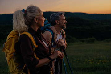 Couple with backpackers exploring nature together