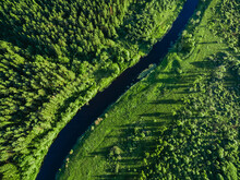 Aerial View Of Green Woods With Blue Curved River. Beautiful Summer Landscape