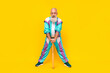 Full size photo of positive granddad hold bat wear 90s outfit sport suit isolated on yellow color background