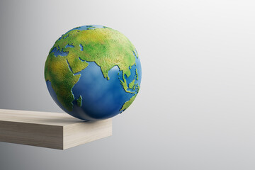 Poster - Abstract image of globe on edge of wooden block trampoline and mock up place on gray background. 3D Rendering.