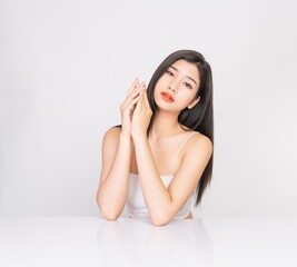 Wall Mural - Portrait of a young, smart and very beautiful clean asian sexy female lady wearing white tank top with different elegant poses and emotions against a white studio background