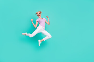 Sticker - Full length body size view of attractive cheerful lucky girl jumping rejoicing having fun isolated over teal turquoise color background