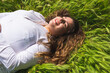 © ADDICTIVE STOCK - Content woman lying in grass