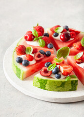 Wall Mural - watermelon pizza slices with yogurt and berries, summer dessert