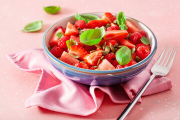 Wall Mural - watermelon salad with strawberry raspberry basil seeds. healthy summer dessert