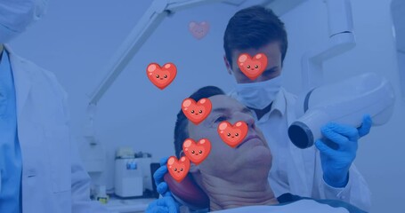 Poster - Animation of heart icons over caucasian male dentist treating caucasian man