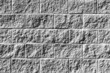 white painted alley cinder block brick wall building exterior shadows