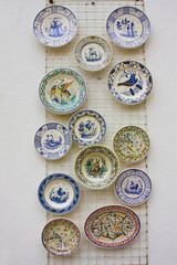 Wall Mural - Traditional ceramic plates with azulezh at souvenir store in Coimbra, Portugal