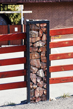 Fence Post Made Of Steel Corners And Wire And Filled With Stones