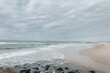 Exuberant ocean with waves and a cloudy gray sky. Traveling in Portugal. Sea view