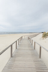  Beautiful sandy beach with a wooden walkway by the sea