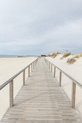  wooden walkway on the beach along the ocean