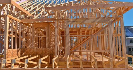Wall Mural - Framing of under construction wooden house building frame structure on a new development