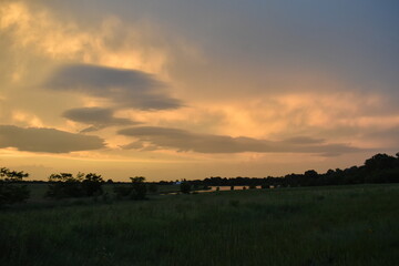 Poster - Dramatic Sunset Over a Lake in a Field