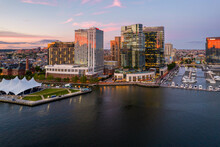 Aerial Drone View Of Baltimore City Inner Harbor At Sunset