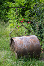 Old-style Garden Roller In A Paddock