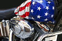 Side View Motor And The Fuel Tank Of A Motorcycle With An American Flag.