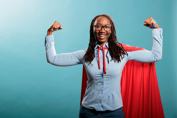 happy positive justice defender flexing arms as a sign of strength while standing on blue background