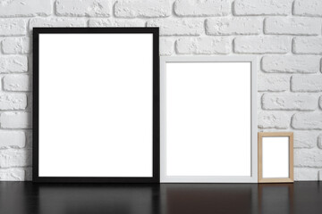 Wall Mural - Blank picture frame against brick wall with copy space