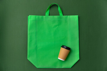 Wall Mural - Textile shopping bag and coffee cup flat lay