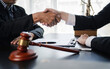 © crizzystudio - Lawyers shake hands with business people to seal a deal with partner lawyers. or a lawyer discussing contract agreements, handshake concepts, agreements, agreements