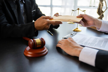 Wall Mural - lawyer or judge is taking a bribe. In the client's courtroom at the lawyer's office In order to bribe to gain an advantage in the form of lawsuits, the concept of bribery and corruption in law