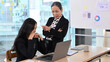 © Prathankarnpap - Irritated mature manager scolding, accusing young female employee, verbal warning about work failure