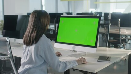 Business Woman Hands Working Internet on Computer On Desk. Girl Surfing on PC with Green Screen Notebook. Close Up Female Freelancer Searches For Information on The Internet