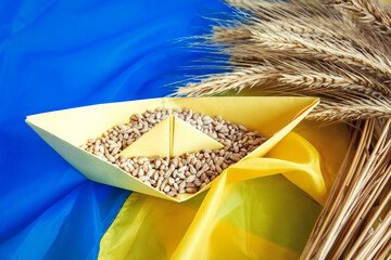 Wall Mural - grain wheat and spikelets on a blue background. Ukrainian grain and problems of sea blockade of ports.	
