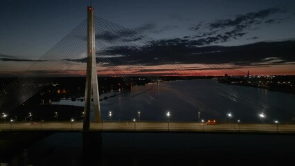 Wall Mural - Aerial panoramic view of the Riga bridge across river Daugava at night. Cable-stayed bridge in Riga, Latvia at night.