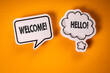 Welcome. Speech bubbles with text on an orange background