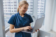 © Yaroslav Astakhov - Focused female healthcare worker using laptop while working at doctor's office