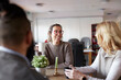 © Johnér - Co-workers talking during coffee break