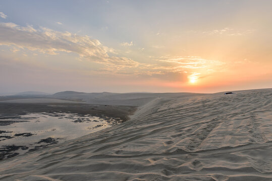 Wall Mural - Sunset over Sealine sand dunes, Qatar, Middle East