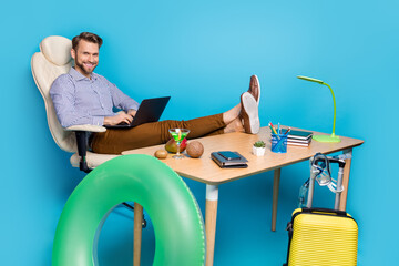 Poster - Full body portrait of cheerful successful man sit chair use wireless netbook isolated on blue color background