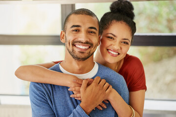 Poster - Love brought and kept us together. Portrait of a happy young couple embracing at home.