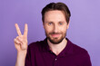 Photo of young handsome man show fingers peace cool v-symbol vacation isolated over violet color background