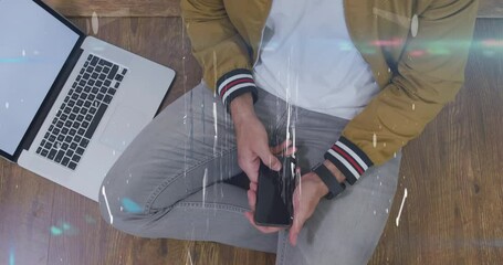 Poster - Animation of shapes over midsection of caucasian man using laptop and smartphone with copy space