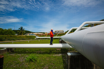 Poster - Male worker inspection at valve of visual check record pipeline oil and gas