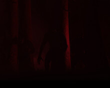 A Trio Of Dogman Or Werewolf Cryptids Standing A Forest Lit By Red Light